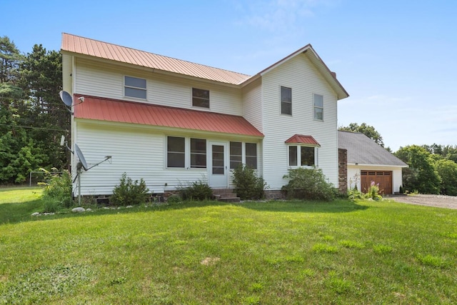 view of front facade featuring a garage and a front yard