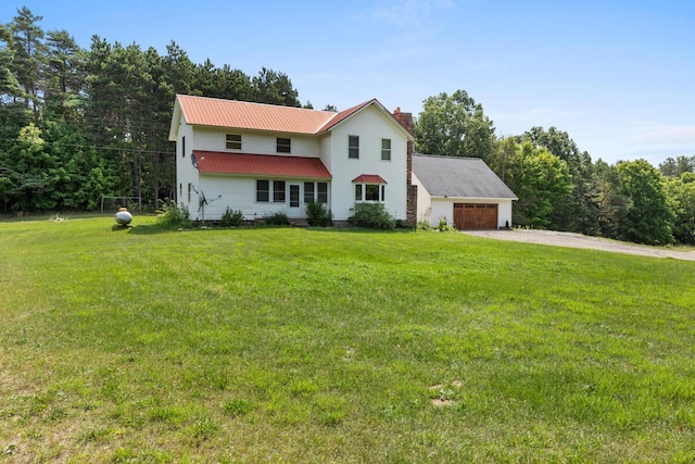 view of front facade featuring a garage and a front lawn