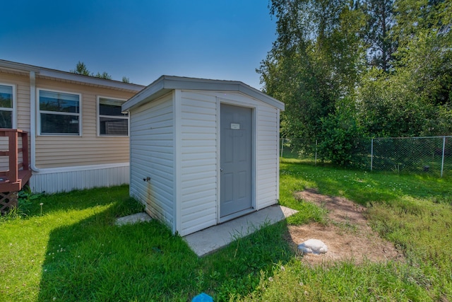 view of outbuilding with a lawn