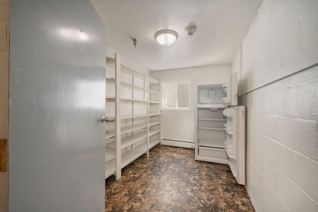 walk in closet featuring a baseboard heating unit