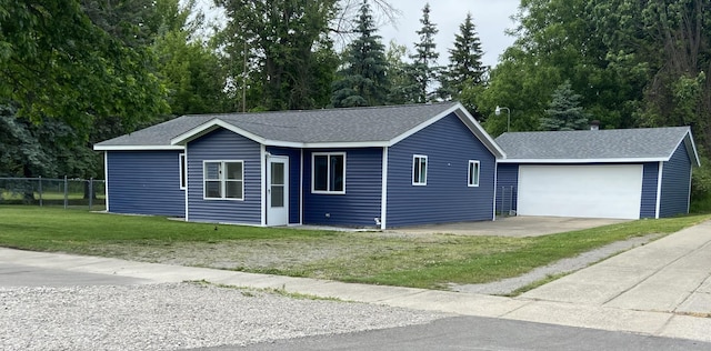 ranch-style home featuring a garage and a front yard