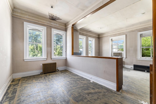 unfurnished sunroom with a healthy amount of sunlight, radiator, and cooling unit