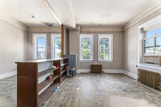 misc room featuring cooling unit, a healthy amount of sunlight, and radiator