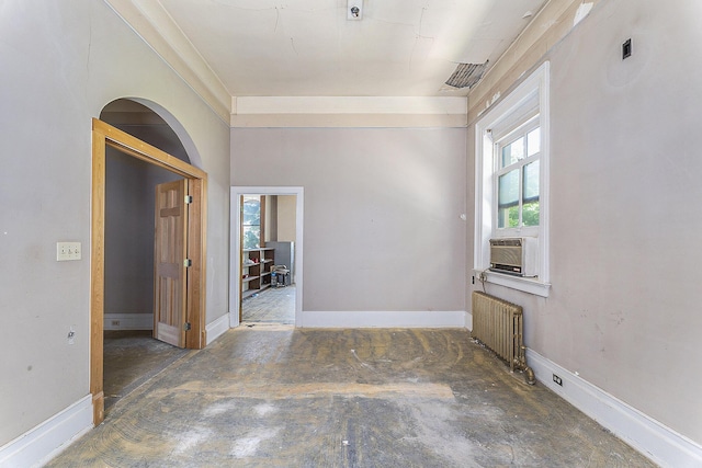 spare room featuring radiator and cooling unit