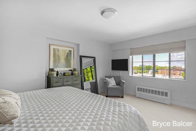 carpeted bedroom with radiator