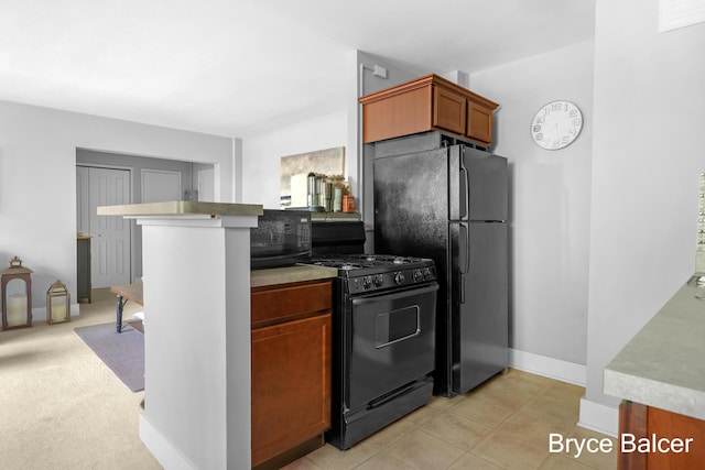 kitchen featuring black appliances and kitchen peninsula