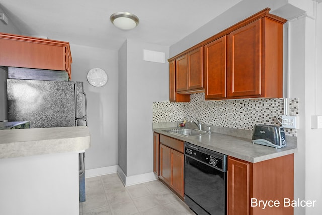 kitchen featuring sink, decorative backsplash, and black appliances