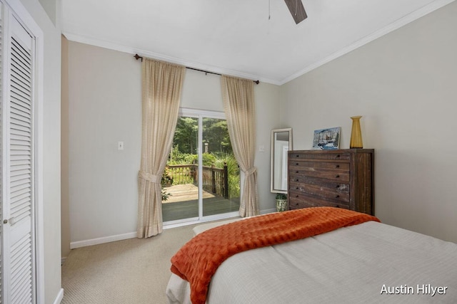 bedroom featuring ceiling fan, access to exterior, carpet flooring, ornamental molding, and a closet