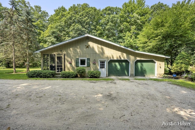 view of side of home with a garage