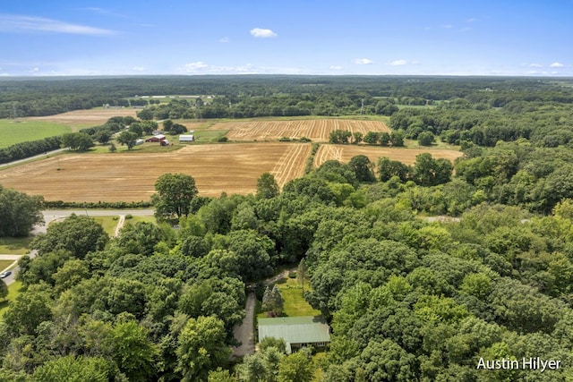 birds eye view of property with a rural view