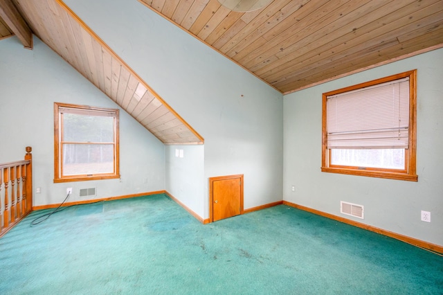 bonus room featuring carpet, lofted ceiling with beams, and wooden ceiling