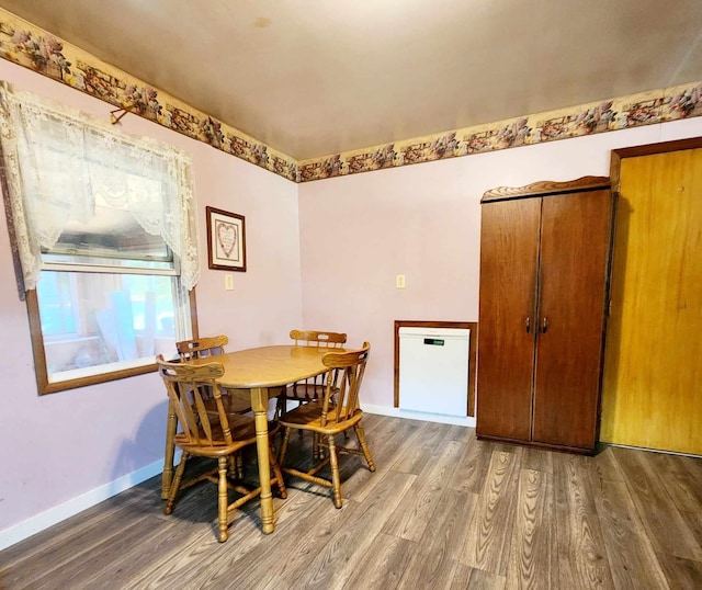 dining room with hardwood / wood-style flooring