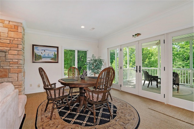 dining room with ornamental molding and french doors