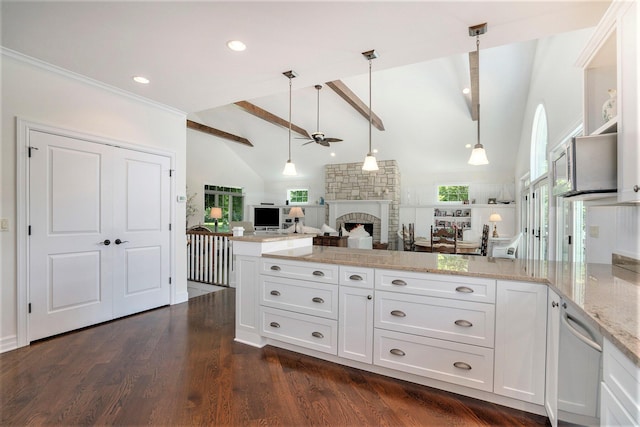 kitchen with white cabinetry, a wealth of natural light, pendant lighting, and beam ceiling