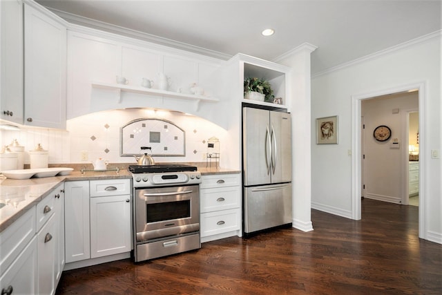 kitchen featuring stainless steel appliances, light stone countertops, ornamental molding, white cabinets, and dark hardwood / wood-style flooring