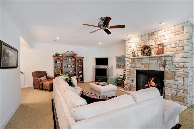 living room with crown molding, light carpet, ceiling fan, and a fireplace