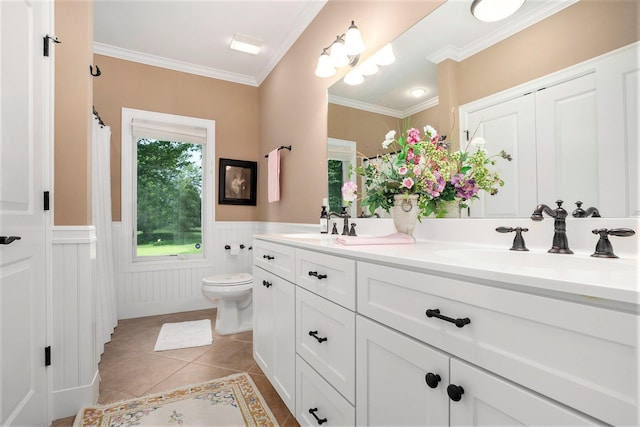 bathroom featuring vanity, ornamental molding, tile patterned floors, and toilet