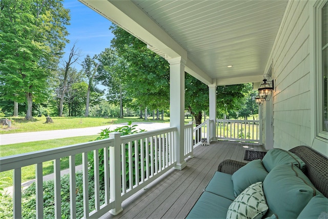 wooden deck featuring covered porch