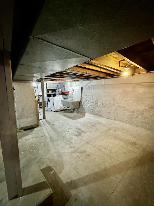 basement with washer and clothes dryer