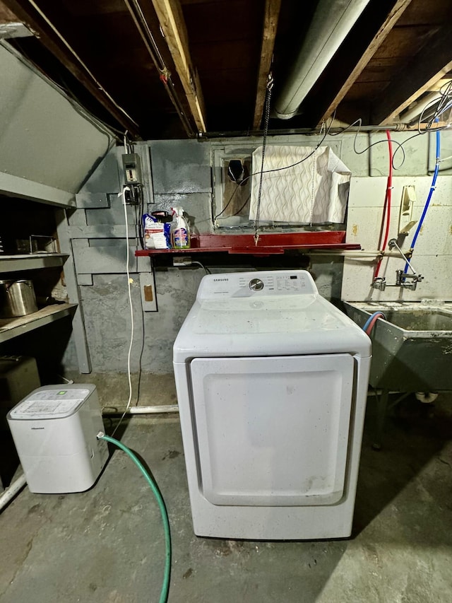 utilities featuring washer / clothes dryer and sink