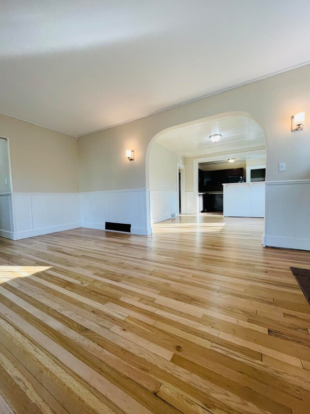 unfurnished living room with light hardwood / wood-style flooring