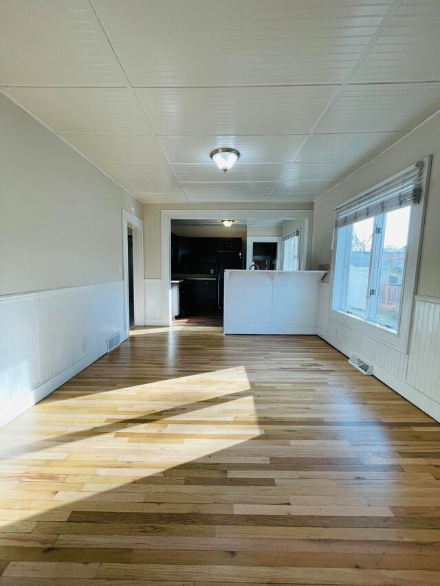 unfurnished living room with light hardwood / wood-style floors