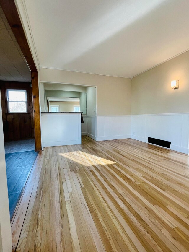 unfurnished living room featuring light hardwood / wood-style flooring