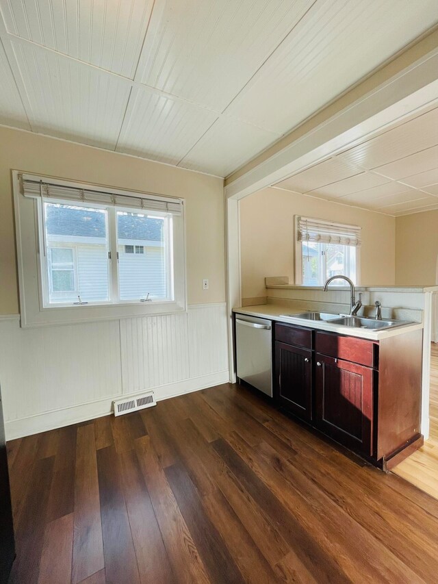 kitchen featuring sink, wood-type flooring, and dishwasher