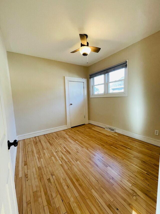 unfurnished bedroom with light hardwood / wood-style flooring and ceiling fan