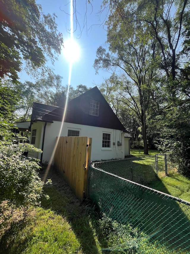 view of home's exterior featuring a lawn