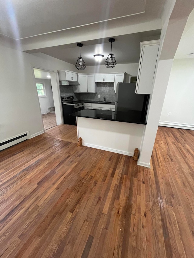 kitchen with fridge, white cabinets, and dark hardwood / wood-style floors