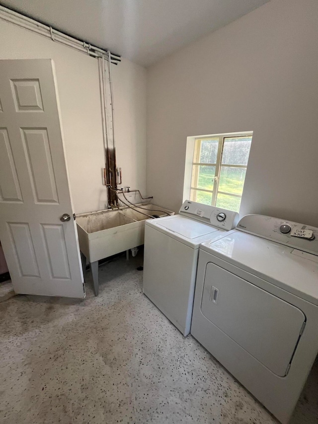 laundry area featuring sink and washing machine and dryer