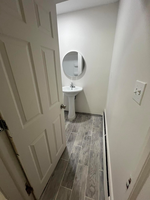 bathroom with sink and hardwood / wood-style floors