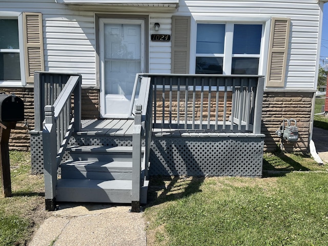 property entrance with a deck