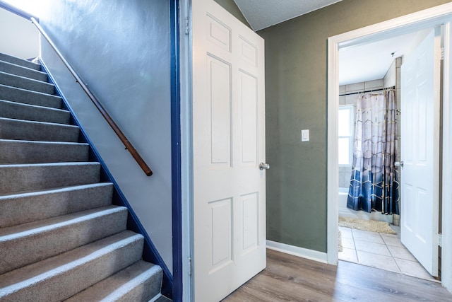 stairway featuring hardwood / wood-style floors