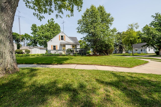 view of front of home with a front yard and covered porch