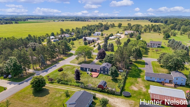 birds eye view of property with a rural view