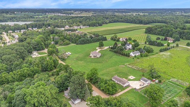 aerial view with a forest view and a water view