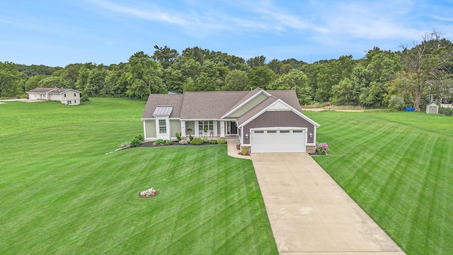 view of front of house featuring an attached garage, concrete driveway, and a front yard