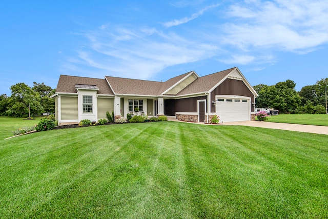 craftsman house featuring a garage and a front yard