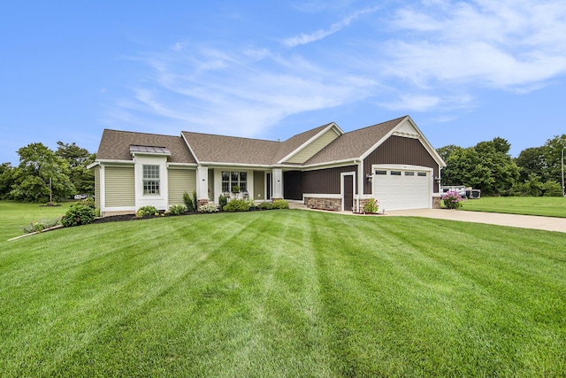 view of front of property with a shingled roof, a front lawn, driveway, stone siding, and an attached garage