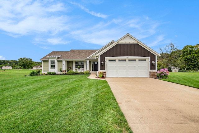 craftsman house featuring a garage and a front yard