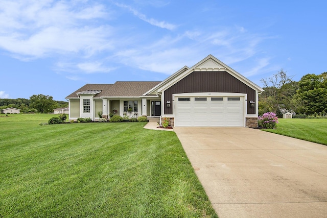 view of front facade featuring driveway, stone siding, board and batten siding, a front yard, and a garage