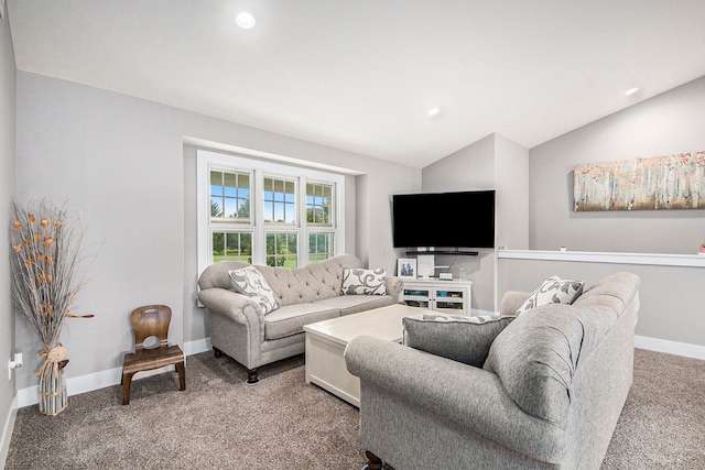 carpeted living room with lofted ceiling