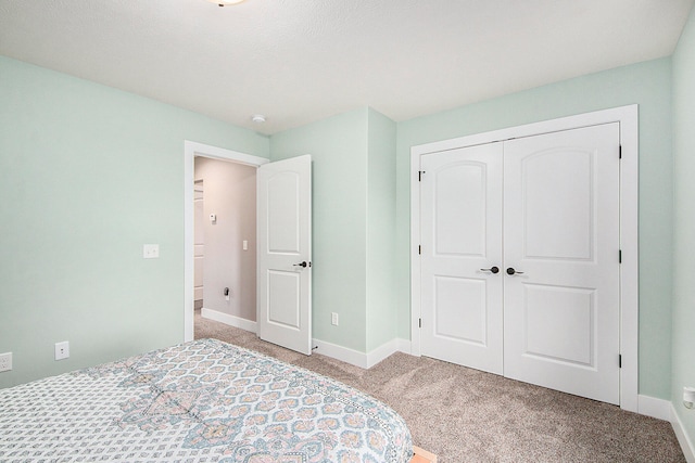 unfurnished bedroom with light carpet and a closet