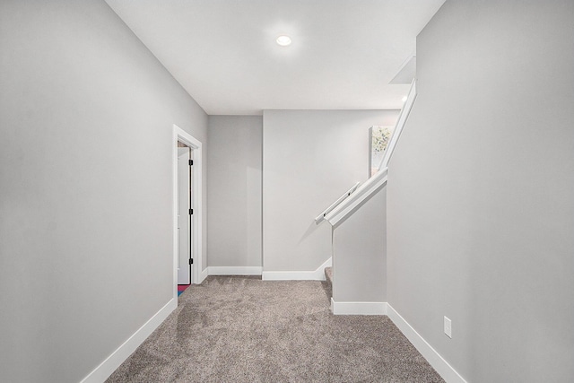 interior space featuring recessed lighting, baseboards, stairs, and carpet