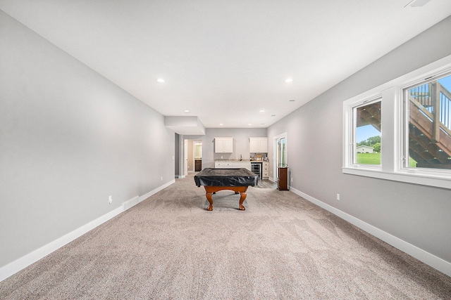 recreation room featuring a healthy amount of sunlight, light carpet, and billiards