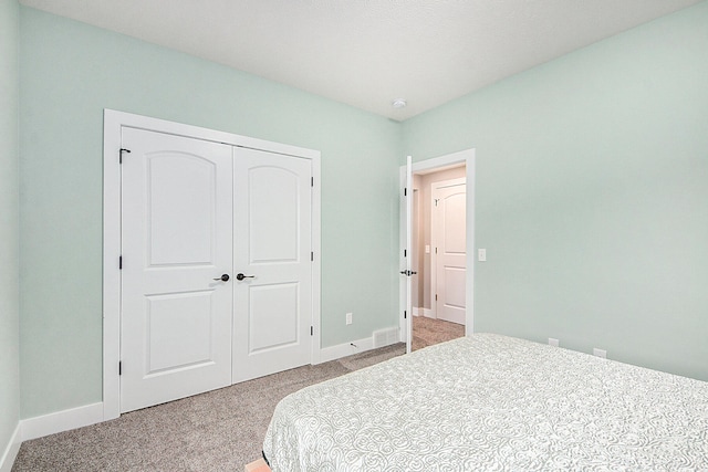 carpeted bedroom featuring a closet