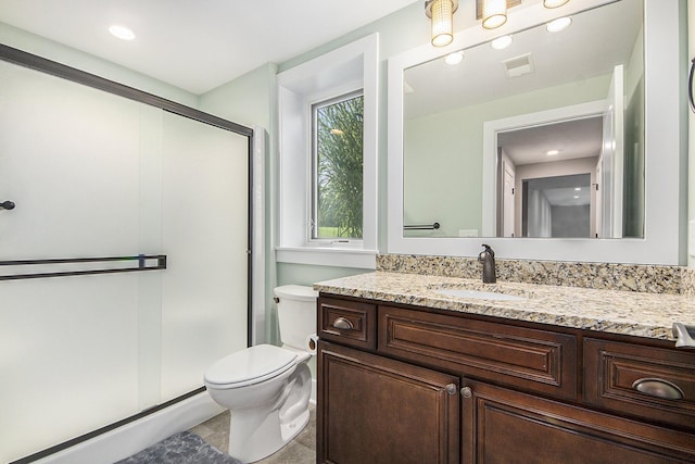 bathroom with visible vents, a shower stall, toilet, recessed lighting, and vanity