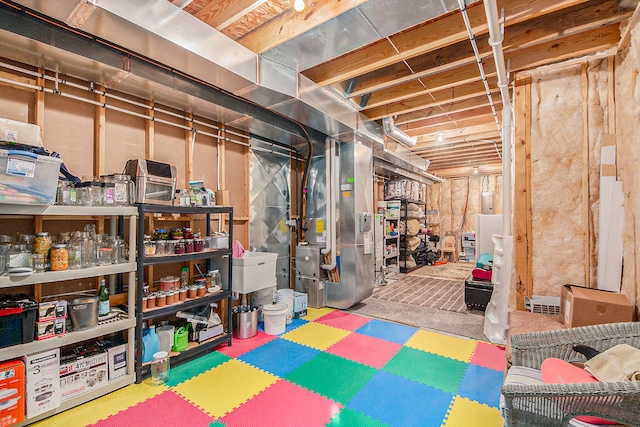 basement featuring heating unit